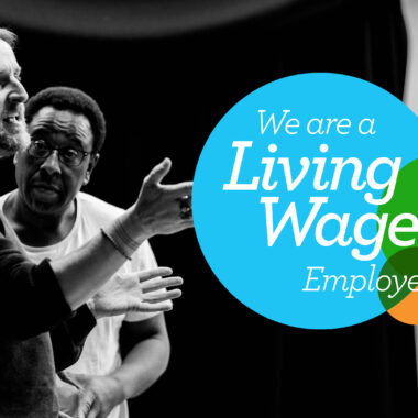 A black and white photograph of a Citz workshop participant and Tony Cealy, the workshop leader, overlaid with the Living Wage UK logo